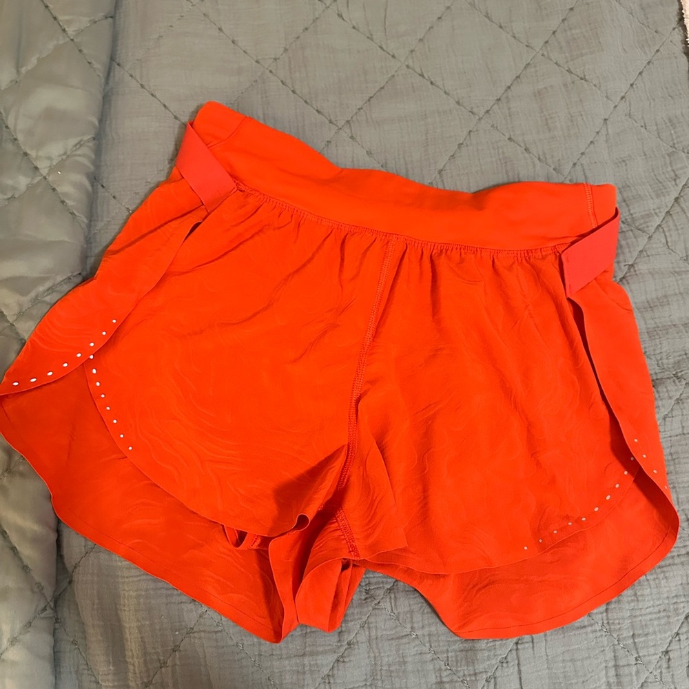 Lululemon Athletica Orange Athletic Shorts with Flowy Design
